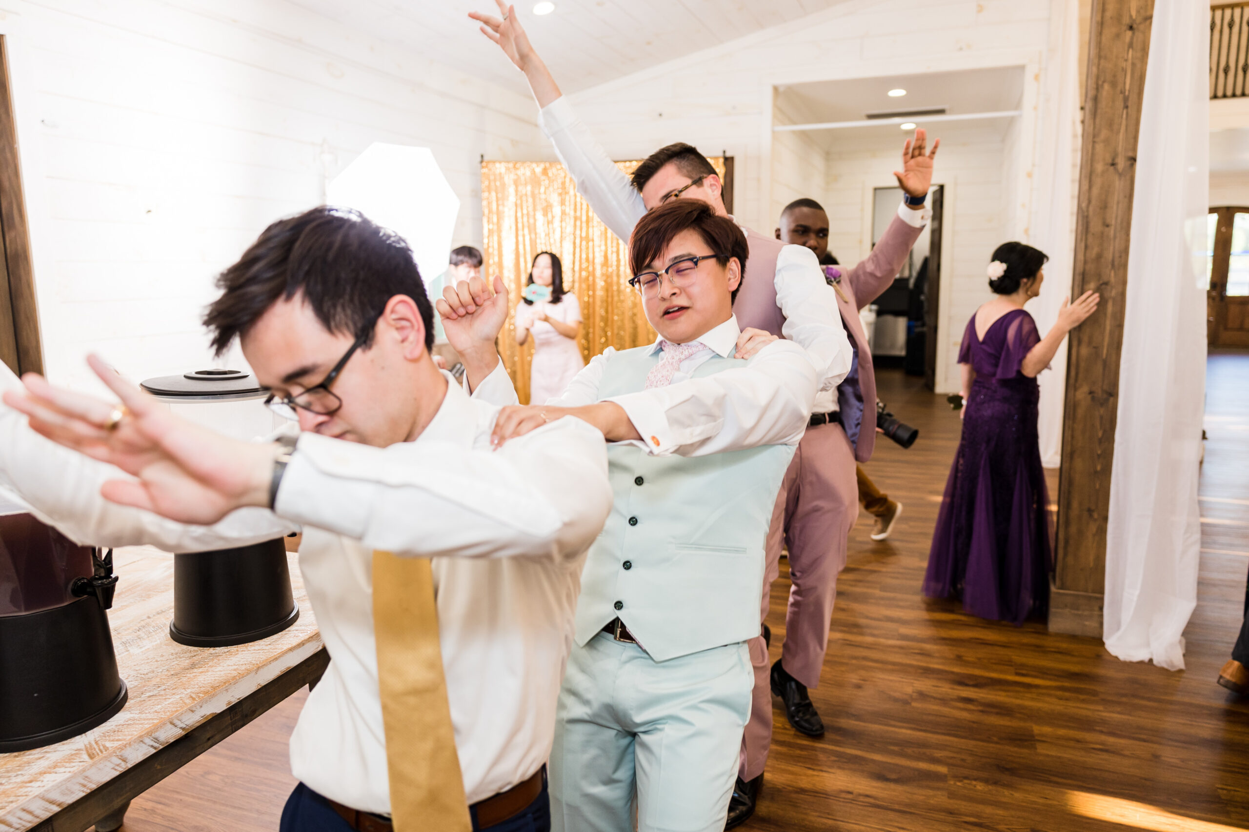 Groom and his groomsmen forms a line and dancing